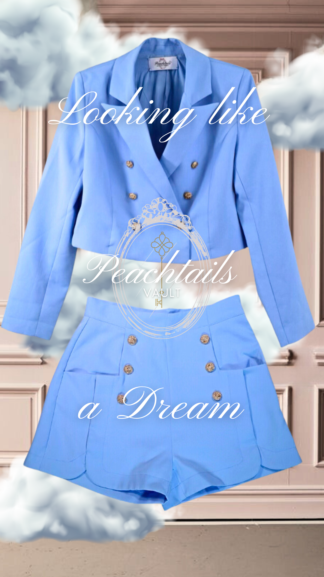 The image showcases a vibrant blue women's blazer and matching shorts from the "Peachtails VAULT" collection. The ensemble is superimposed on a soft, dreamy background with clouds and a classic architecture motif. Above the outfit, in a flowing script, it reads "Looking like," and below, "a Dream," framing the clothing in the center. The Peachtails logo is delicately placed over the blazer, suggesting a blend of style and fantasy in the design.